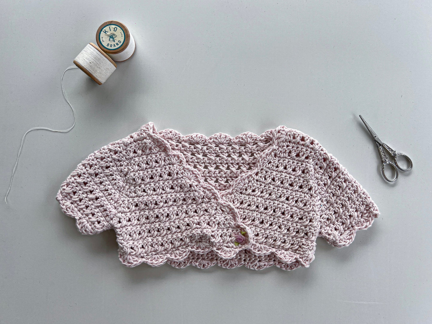 Pink cropped, cap sleeve crochet jersey (6-18 months)